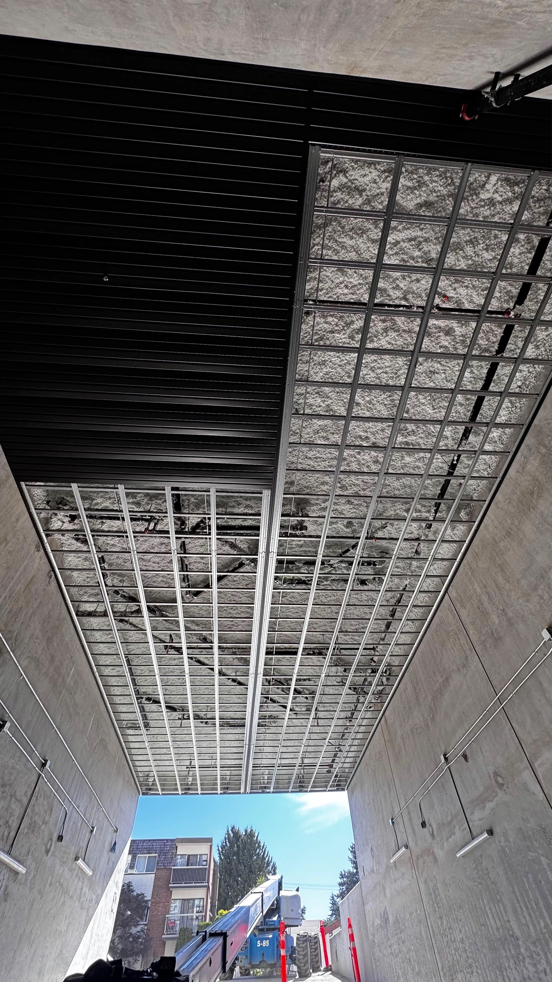 Vented soffit over a parkade ramp
